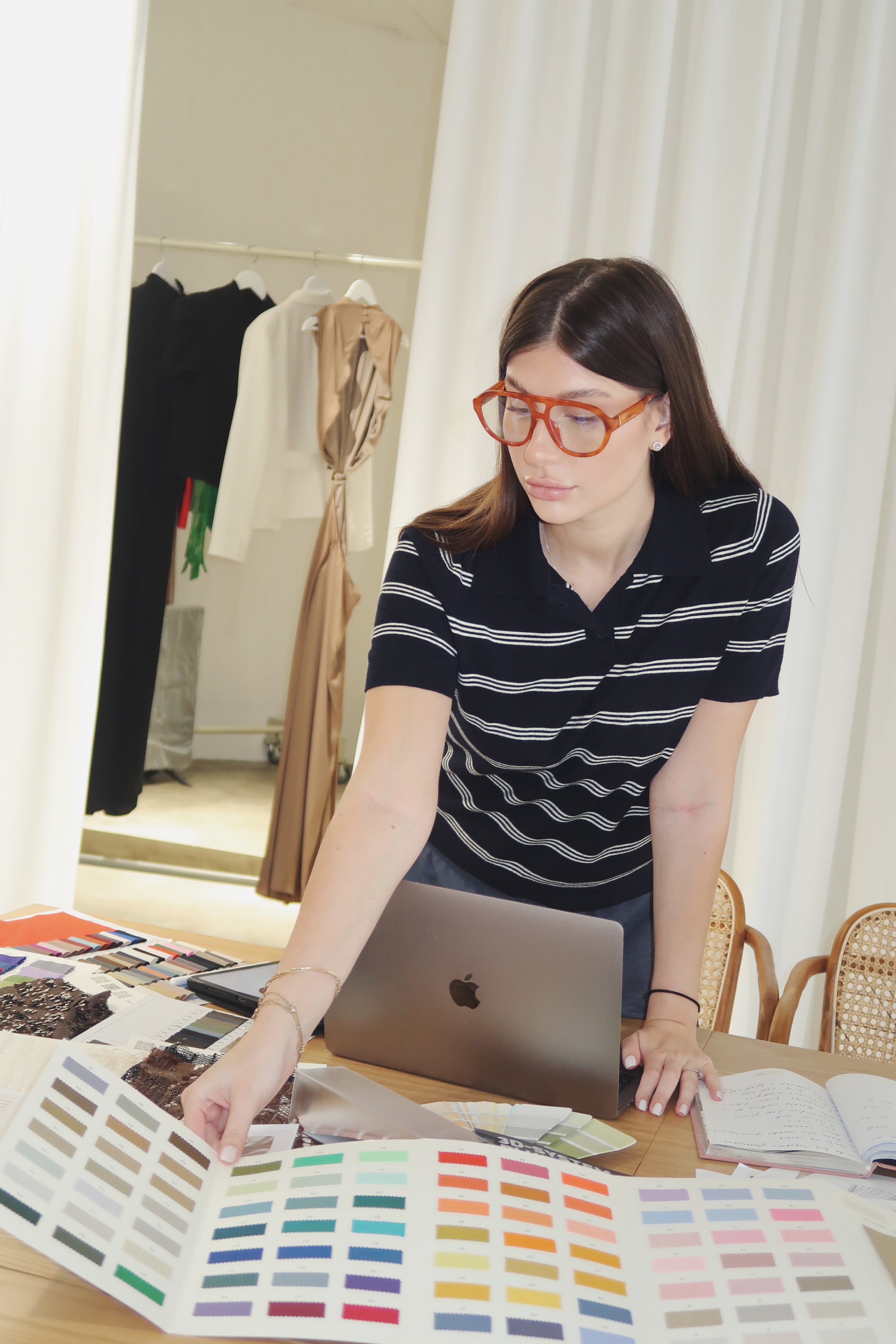 Nini reviewing a colour palette at her work table