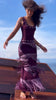Model walking on a boat deck in the burgundy Fringe Knit Maxi Dress, with fringe in motion.