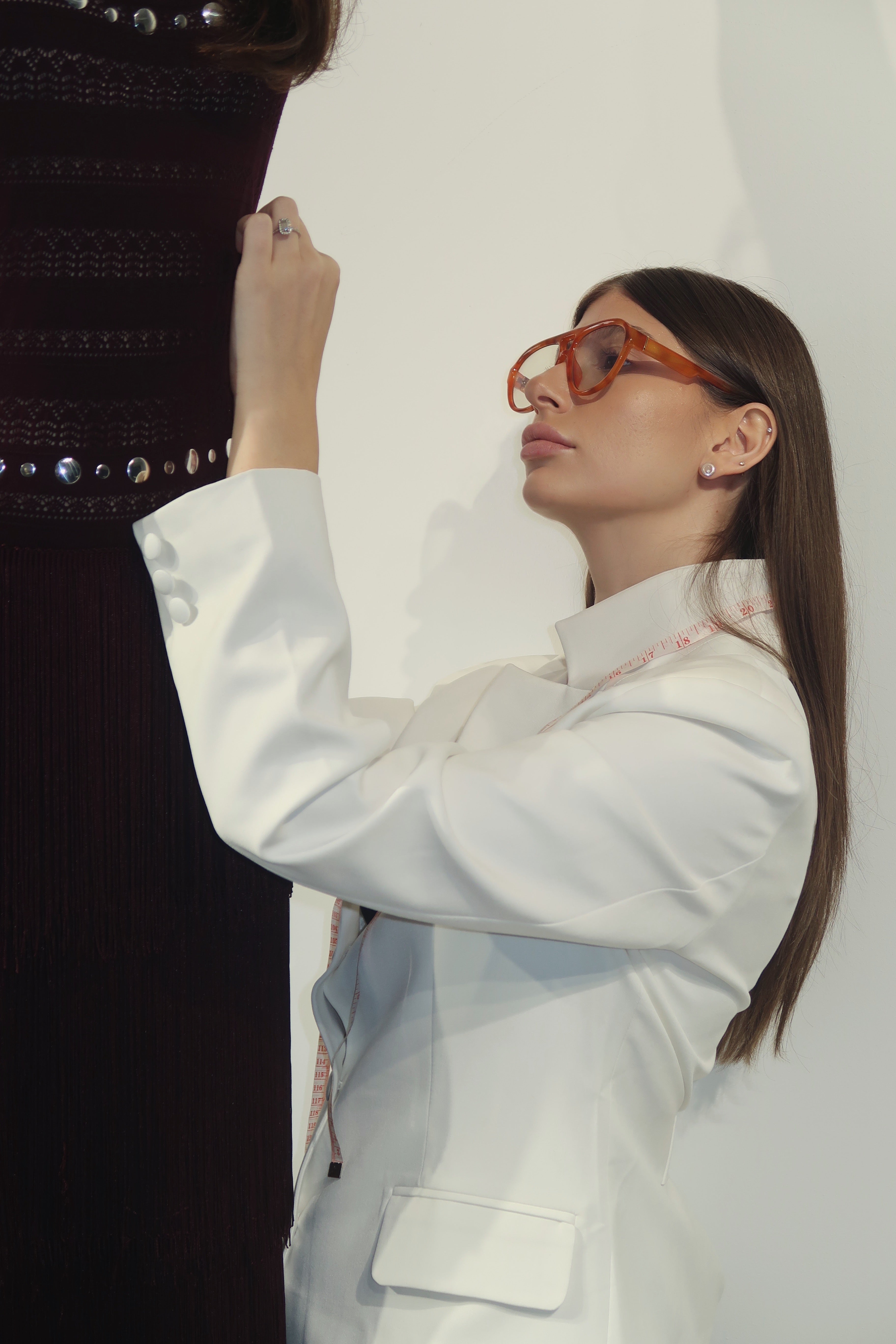 Nini Manjgaladze fitting a Seen Studios garment in the studio